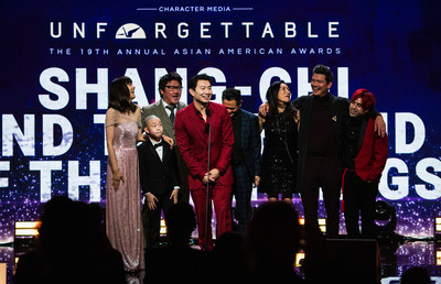 Simu Liu and the cast of Marvel's "Shang-Chi and The Legend of The Ten Rings" accept the Vanguard Award, which celebrates a seminal work of film or TV that reshapes the entertainment landscape, at the 19th annual Unforgettable Gala, at the Beverly Hilton. (Photograph by Daniel Byun)