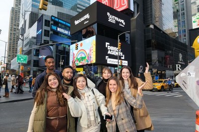 Future First Studio poses in Times Square with their winning creative “UP2U”