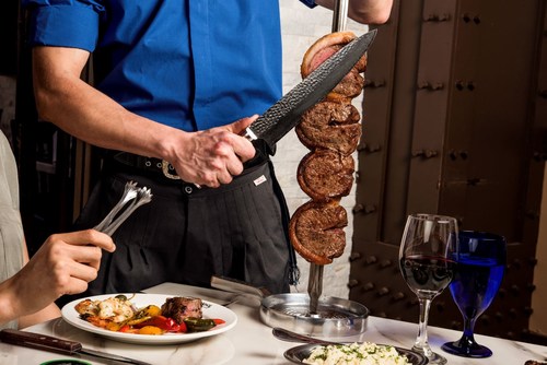Texas de Brazil, the Brazilian Steakhouse known for its various cuts of flame-grilled meats served tableside, opening in Omaha, NE (PRNewsfoto/Texas de Brazil)