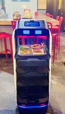Supporting employees and enhancing efficiencies, Patty the Robot delivers an all-natural Cheeseburger, Chicken Tenders and fresh-cut fries directly to the table of a hungry customer at BurgerFi’s new Indiantown Road location in Jupiter, FL.