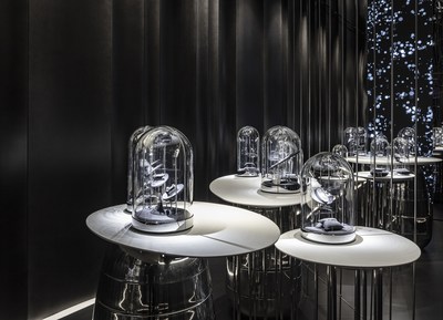 Jewelry pieces of Âme are displayed beneath elegant glass cloches