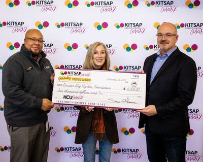 The KCUCares Foundation launched by donating $150,000 to local charities. Photographed from L to R - Kevin Moffet, Kitsap Credit Union Gig Harbor Branch Manager, Julie Gustanski of Greater Gig Harbor Foundation, Shawn Gilfedder, President/CEO Kitsap Credit Union.