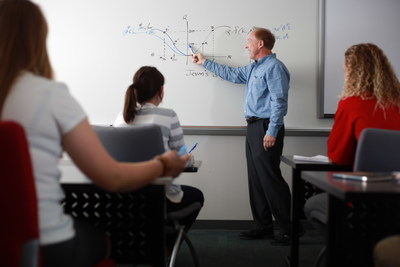 Dr. Peter Bias, Professor of Business and Economics and Department Chair of Economics and Finance, teaching students in the Becker Business Building at Florida Southern College.