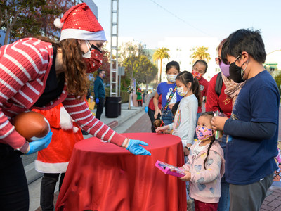 7,000 gifts were placed in children’s hands at the Candy Cane Lane toy giveaway December 19 at the Church of Scientology Los Angeles