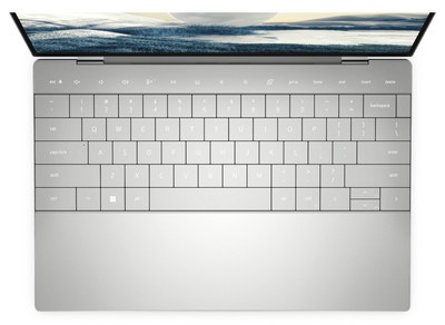 Capacitive touch function row, seamless glass touchpad with haptics and zero-lattice keyboard maximize user interfaces for a streamlined interior design