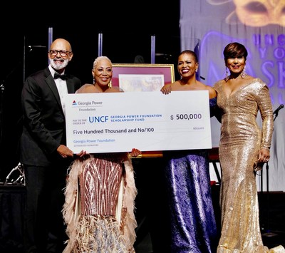 Bentina Terry, senior vice president of Regional External Affairs & Community Engagement and Charmaine Ward-Millner, director of Corporate Relations at Georgia Power present a check for $500,000 to UNCF at their Mayor’s Masked Ball Atlanta.