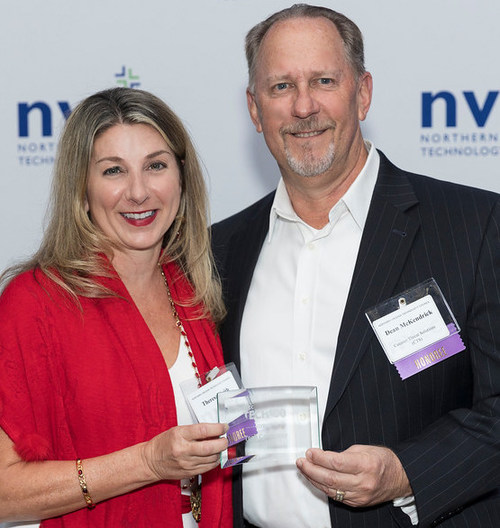 Counter Threat Solutions CEO Theresa Keith and Executive Vice President Dean McKendrick accept the NVTC Tech 100 honor at NVTC's December 2021 celebration in Tysons Corner, VA.