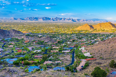 The mansion’s hillside location allows for sweeping views over the lower valley and to the surrounding Phoenix Mountains. The Phoenix Mountain Preserve (not pictured) is adjacent to the property parcel, preventing encroaching development. More at ParadiseLuxuryAuction.com.