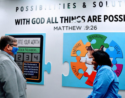 AmPac’s central philosophy is prominently displayed on the “All Things Are Possible” wall.