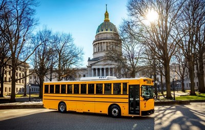 GreenPowers BEAST all-electric school bus in front of the West Virginia State Capital