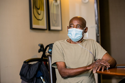 An older adult guest in National Health Foundation's recuperative care program receives health and social services before transitioning to stable housing.