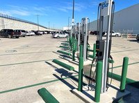 FLO charging stations installed at GM facility in Arlington, TX. A total of 56 FLO level 2 stations are now available there for GM employees. (Photo: Lake Erie Electric and Lone Star Electric.) (CNW Group/FLO)