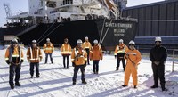 The ArcelorMittal team at Port-Cartier port facilities presented the steel-headed cane to Captain Aldwin Revelar and Chief Officer Sher William Alvaran of the Santa Barbara. (CNW Group/ArcelorMittal S.A.)