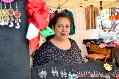 Ledy, a Grameen America member in Oakland and owner of a clothing and jewelry stand.