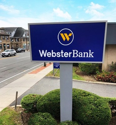 New Webster Bank corporate signage unveiled at a Long Island-based Webster branch.