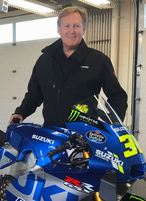 Suzuki Motor USA vice president Kerry Graeber with Suzuki's 2020 GSX-RR MotoGP World Champion race bike.