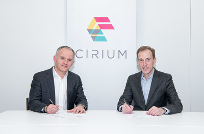 Jeremy Bowen, CEO of Cirium, and Don Thoma, Aireon CEO, ink data-sharing partnership at Cirium London HQ.