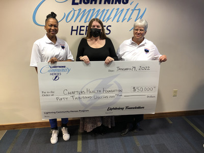 Maxine Reyes (left), Chapters Health Valor Program Coordinator, and Janie Bennett (right), Volunteer Coordinator for HPH Hospice, accept a check from the Lightning Foundation.