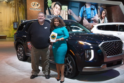 Tom Appel, publisher, Consumer Guide Automotive with Dana W. White, chief communications officer, Hyundai Motor North America, in Chicago, Ill. on Feb. 10, 2022.