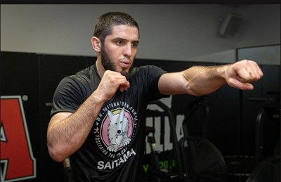 UFC Fighter Islam Makhachev training while wearing a shirt of his sponsor, cryptocurrency Saitama LLC