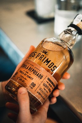 Dos Primos Tequila Reposado is packaged in a clear embossed-glass bottle and features a natural wood cork and genuine black-leather cord wrapped around the neck. The fabric label is hand-applied in Mexico and bears the signatures of Jeff Worn and Thomas Rhett.