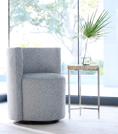 From the Mitchell Gold + Bob Williams SEAQUAL INITIATIVE collection of luxurious recycled fabrics made from SEAQUAL® MARINE PLASTIC:  the easy-care Performance Lattice Chenille, featured on the brand's Poppy swivel chair. Available in four light and silvery shades, it offers a water repellent finish.