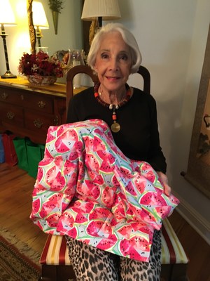 Ann DeFranco shows a weighted therapy blanket made from plastic resin pellets donated by Spartech, LLC. Ann is 91 years old and is the main seamstress sewing nearly all of the blankets (with a little help from her friends).