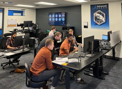 Advanced Space Spring intern Lorin Nugent gets a front row seat and hands on experience with the team as they review simulated mission data during an Operational Readiness Test (ORT). [Front L to R: Connor Ott, Sai Chikine, Tim Sullivan. Back L to R: Sandeep Baskar and Matt Bolliger]
Credit: Advanced Space