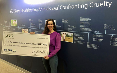 Kristie Tanner, Director of Business Partnerships at the Humane Society of the United States accepts ACE's $43,720 donation