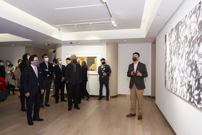 Representative of the curator Li Hong Fei and artist Xu Lei lead guests of honour on a tour of his exhibition, The Innovation of Ink: Transformation and Reinvention of Oriental Aesthetics – Featured Exhibition of Wang Dongling & Xu Lei.