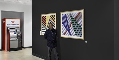 ArtLifting artist, Rudy Jean-Louis, standing next to his artwork in a New York, NY Bank of America financial center.