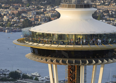 The Space Needle towers over Seattle with improved views including 11-foot tall glass walls on the outdoor deck. Courtesy Hufton & Crow.
