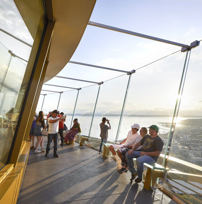 Guests enjoy the Skyriser glass benches at sunset. Courtesy Hufton & Crow.
