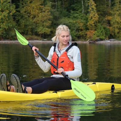 Anna kayaks in her Citrine Yellow Origami Paddler. (PRNewsfoto/Origami Paddler)