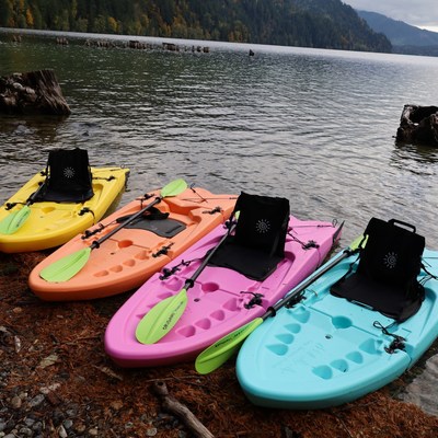 Origami Paddlers on shore featuring all four available colors - Citrine Yellow, Carnelian Orange, Rhodochrosite Pink, and Turquoise Blue. (PRNewsfoto/Origami Paddler)