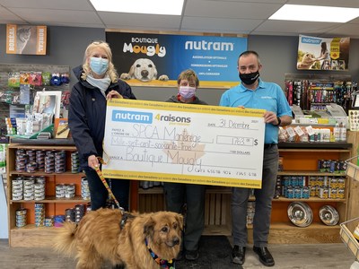 SPCA Montrgie receives cheque for $1,763, courtesy of Nutram Pet Products and Boutique Mougly, Marieville, QC (Groupe CNW/Nutram Pet Products Inc.)