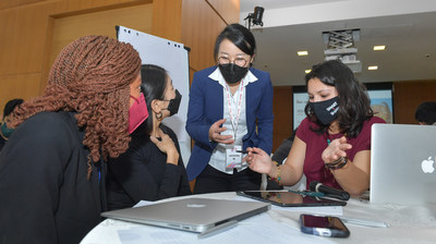 Asia School of Business (ASB) students brainstorming during the five-hour hackathon in Dubai.
