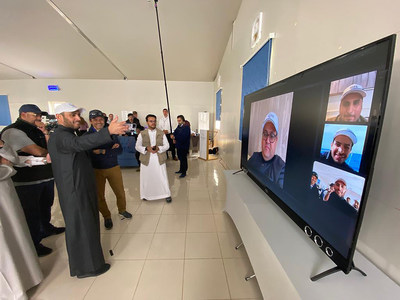CITC Governor, H.E. Dr Mohammed Altamimi and John Pagano Red Sea Project CEO (left), make the world’s first 5G stratospheric video call to multiple users in Riyadh and on a boat off the Red Sea coast (right). (Credit SPL)