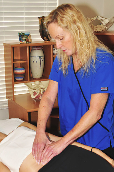 Physical therapist Belinda Wurn treats a patient using Clear Passage® therapy, a hands-on treatment showing success replacing some major surgeries