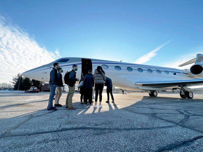 EMU students boarding a private jet at Willow Run airport