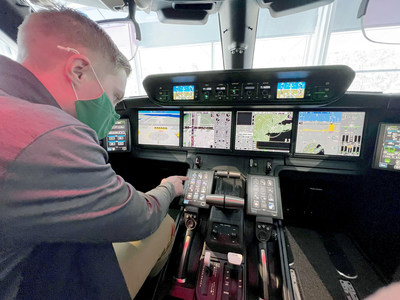 EMU aviation management student Andrew Millett exploring the cockpit of an aircraft