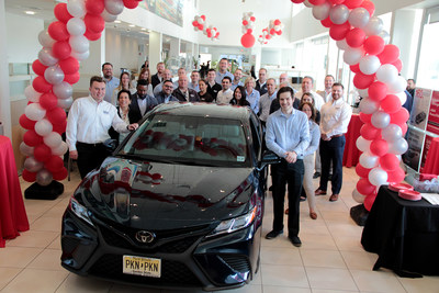 Wayne Maver Jr. celebrates the purchase of the 7 millionth Toyota Certified Used Vehicle with Holman Toyota dealership personnel
