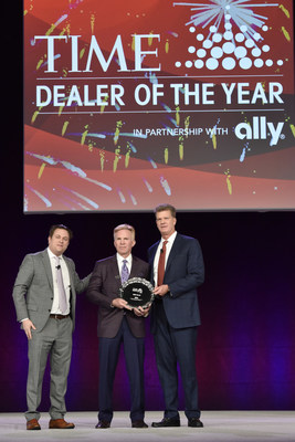 2022 TIME Dealer of the Year Bob Giles celebrates with Keith Grossman, president of TIME, and Doug Timmerman, president of Dealer Financial Services, Ally