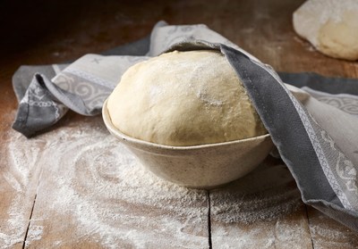 When mixed into a dough, yeast organisms are busy making alcohol and lots of gas through fermentation. The dough can expand in the stomach, blocking the ability for the dough and gas to pass through.  The alcohol produced may result in alcohol poisoning.