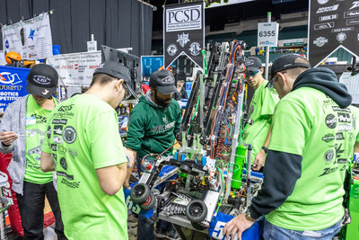 Glenn engineer Calvin Robinson (center) mentors a group of students from the Parma City School District during the 2019 competition at the Wolstein Center. Credit: NASA