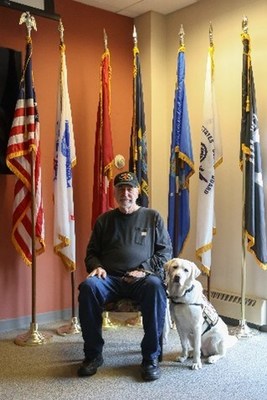 America's VetDog Puppy With A Purpose Ace, raised and trained for 14 months by PenFed Vice President and Chief Content Officer Andrea McCarren, was recently placed with Robert, a Vietnam War veteran.