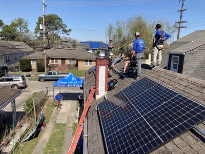 PosiGen Solar and Marathon Capital Team Members install a solar panel system on a New Orleans home as part of their Hero Homes program which gifts free solar systems and energy efficiency upgrades to deserving homeowners.