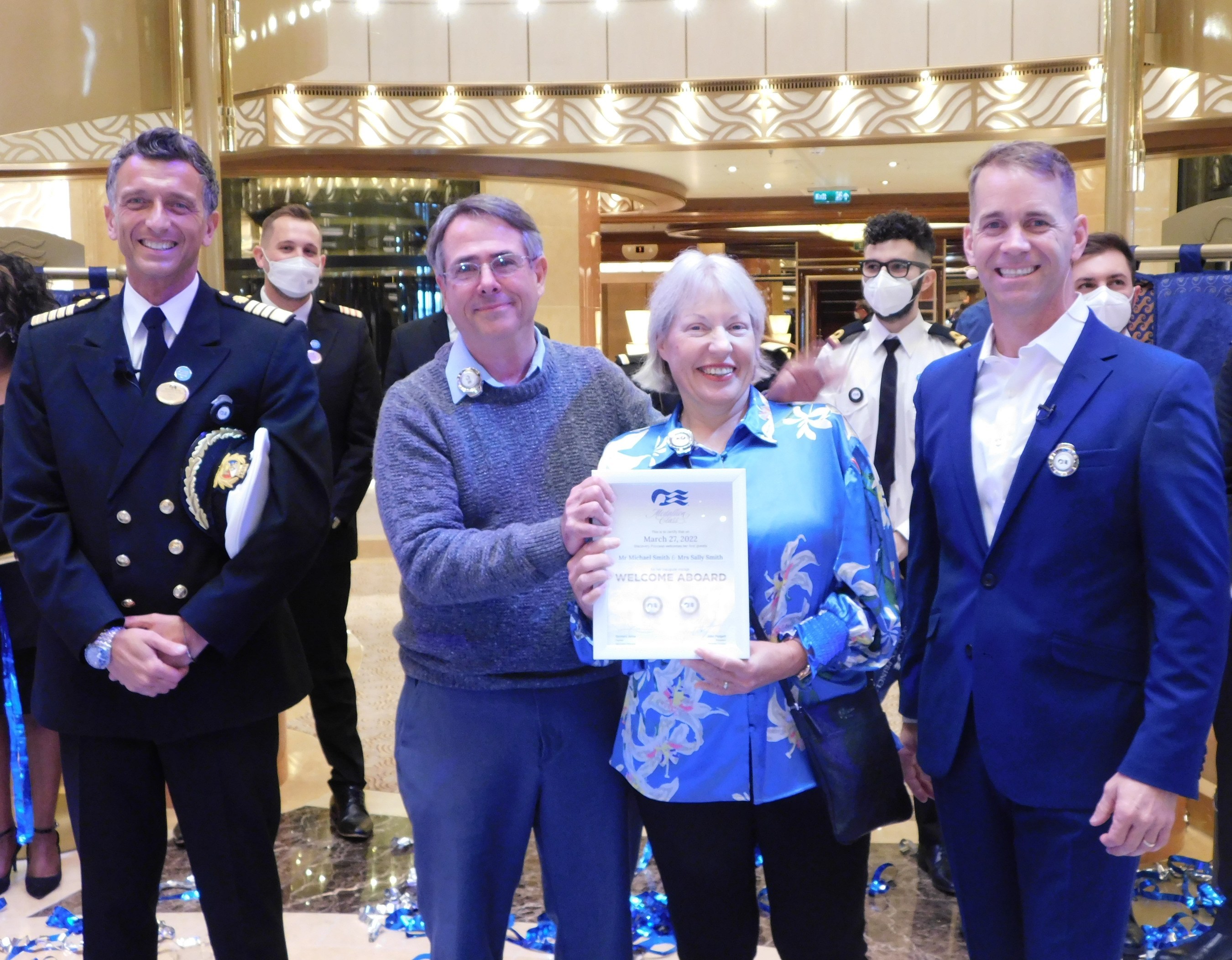 L-R: Captain Gennaro Arma, Discovery Princess first guests Michael and Sally Smith, and Princess Cruises President John Padgett (March 2022)