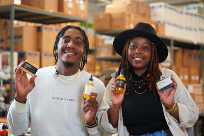 Herb'N Eden owners Quinton (left) and Terran Lewis (right) holding their all-natural products