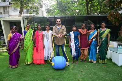 Sanjay Kapoor with rural women for Wells On Wheels